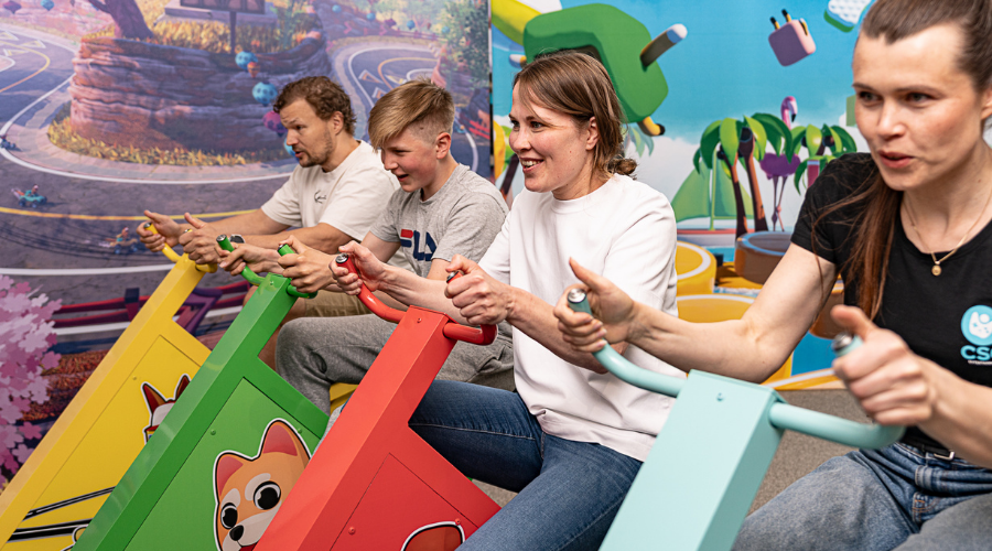 Multible girls playing iWall in school